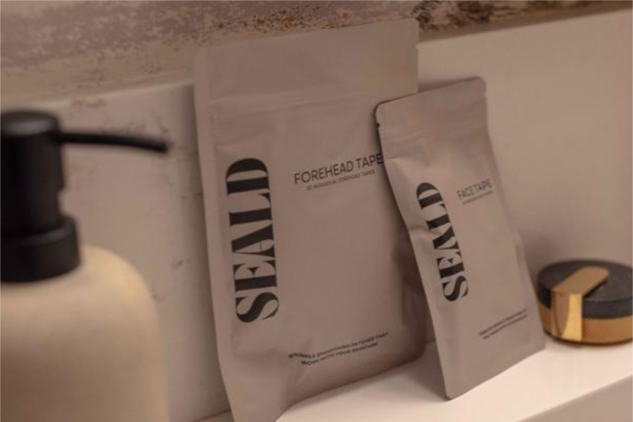 Two packages of SEALD forehead tape on a bathroom counter.